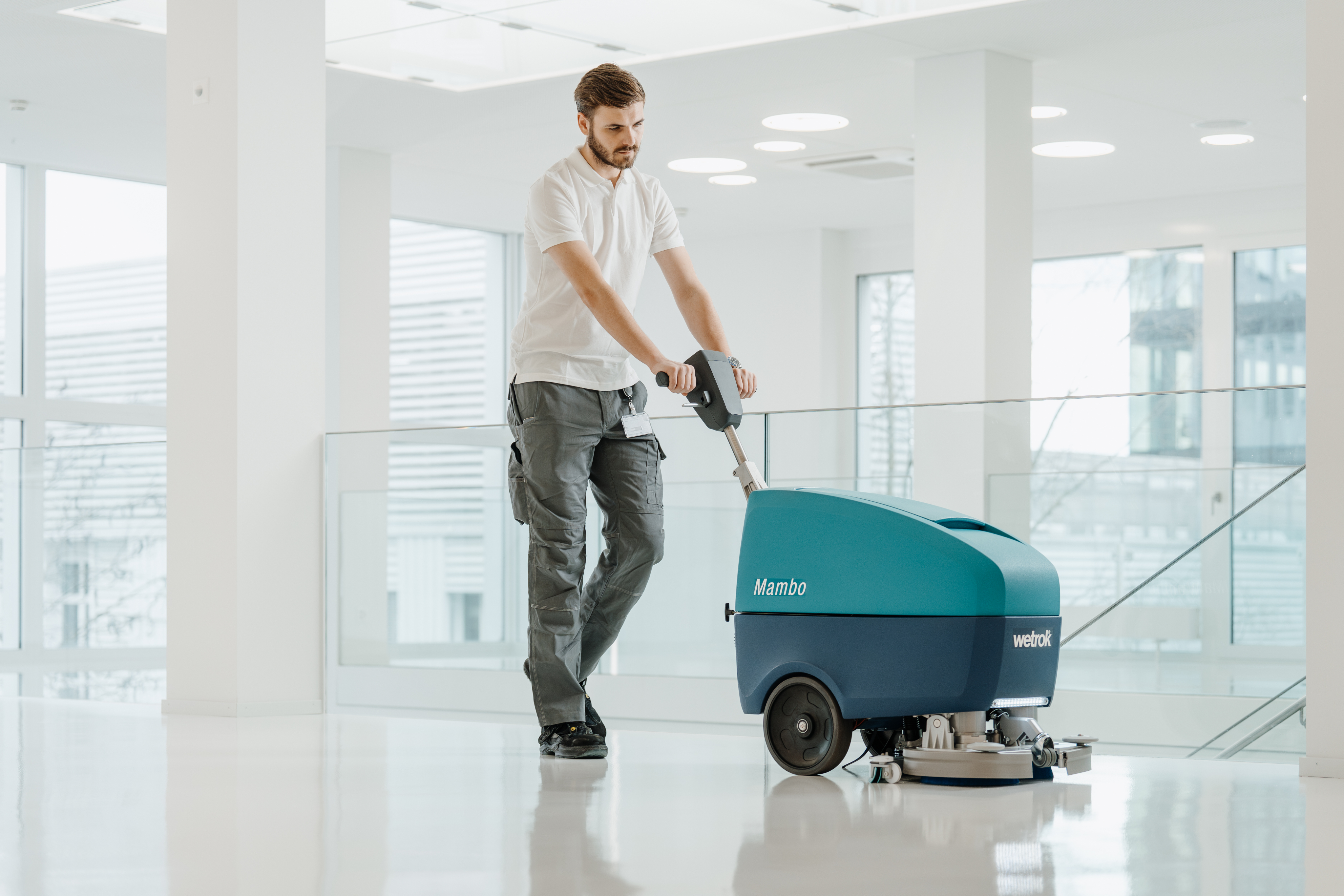 Person at standing desk working on laptop