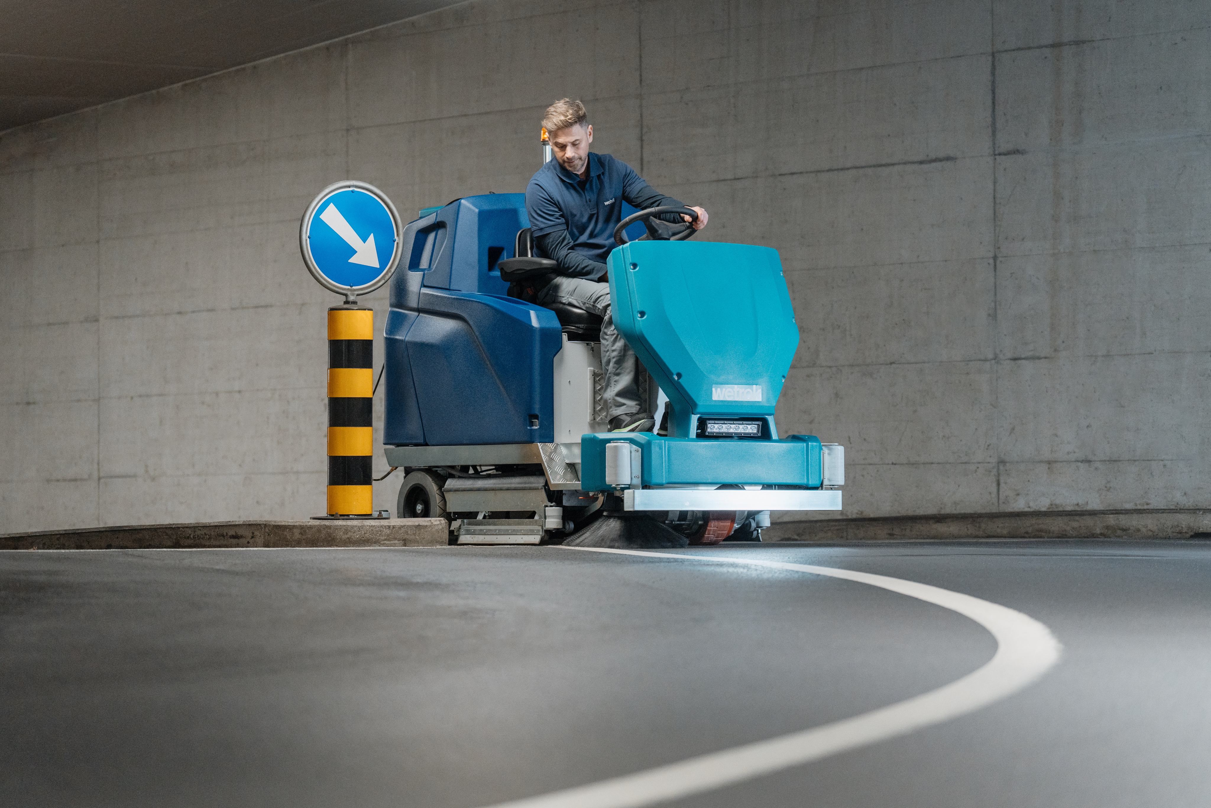 Person sitting on couch working on laptop